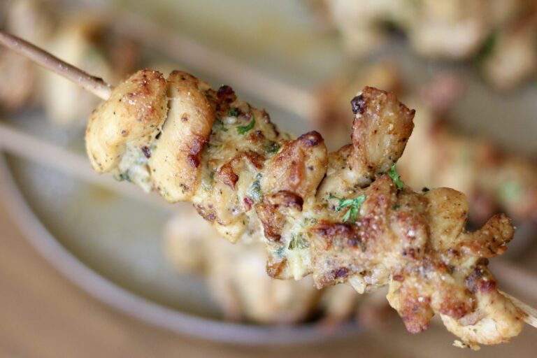 Garlic parmesan skewers held