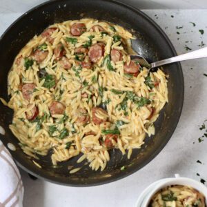 Cajun chicken sausage orzo spooned