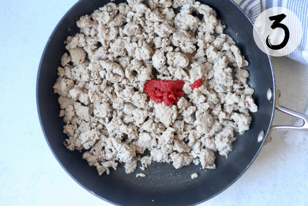 Add tomato paste and water