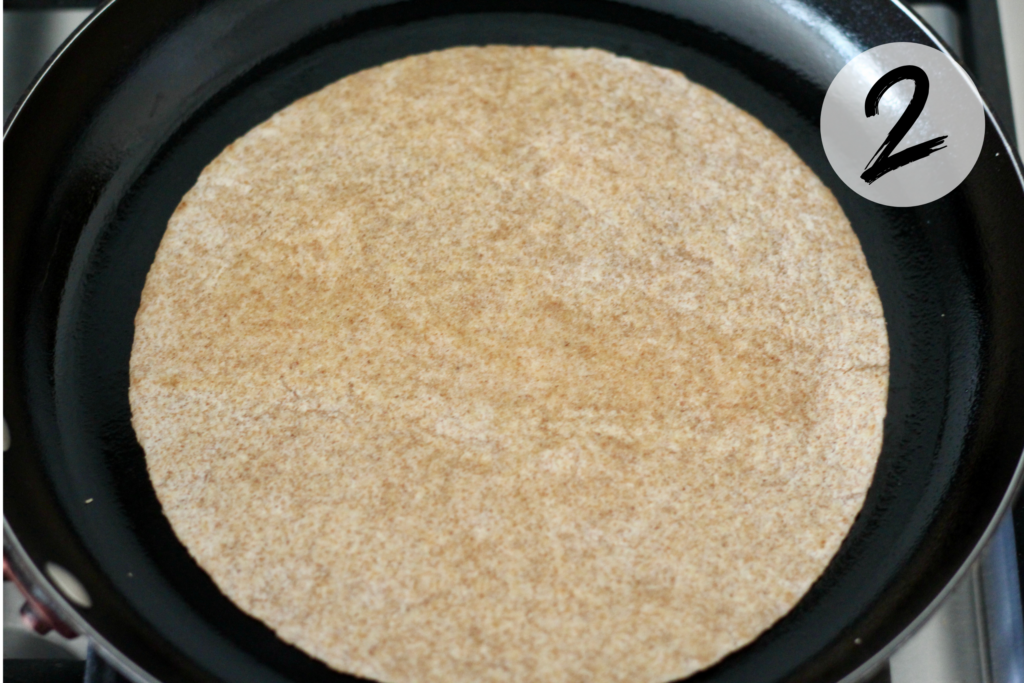 Toast tortilla in skillet
