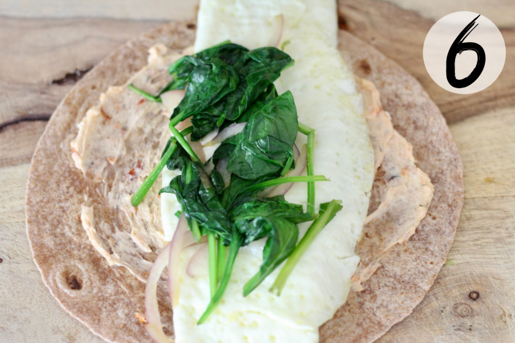 Add egg white omelette, spinach & onions