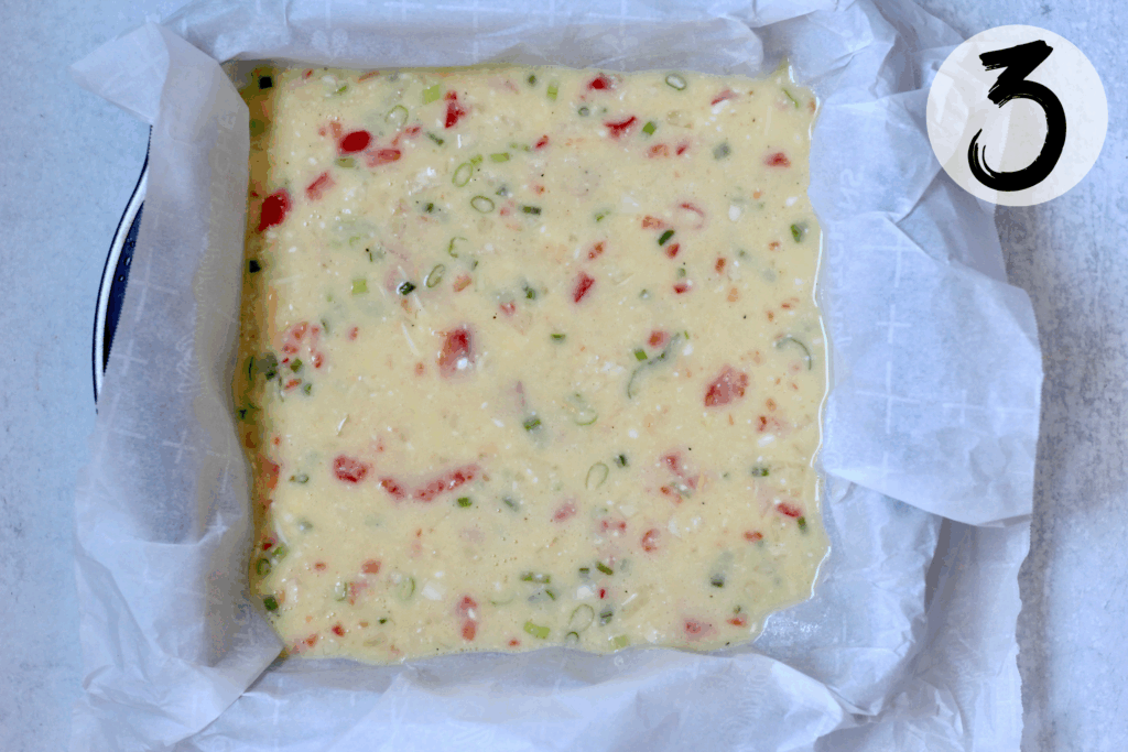 Line baking pan with parchment paper and pour in egg mixture