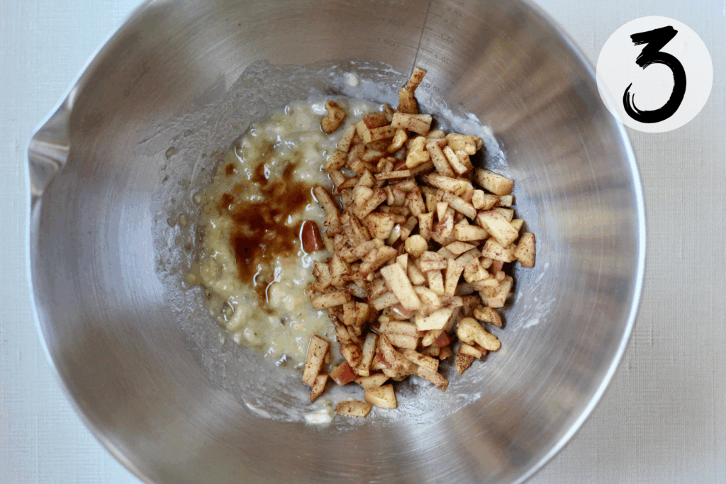 Add vanilla extract and softened apples and mix