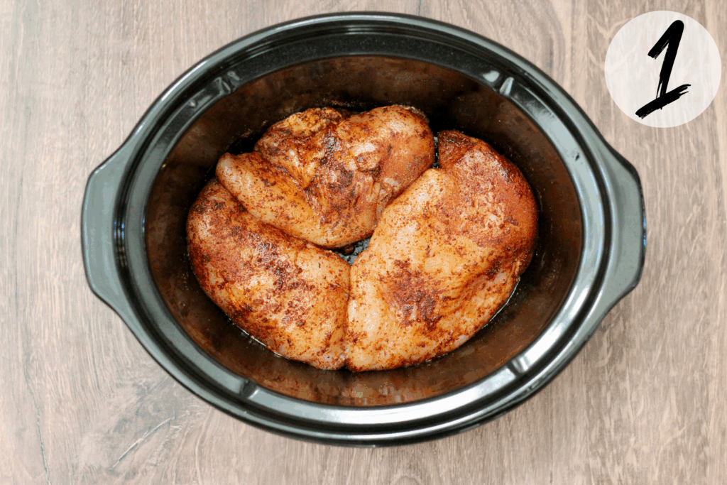 Season chicken breasts with spices