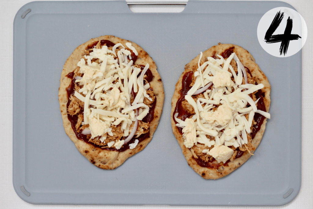 Top with shredded mozzarella and dollops of smoked gouda spread