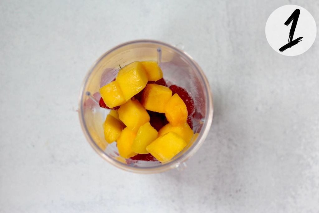 Put frozen strawberries and mango in blender