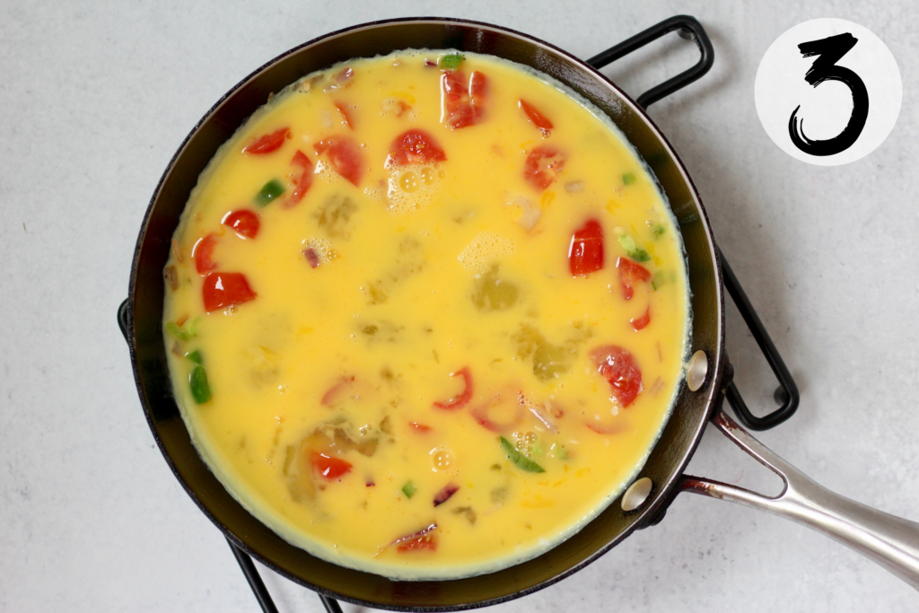 Add egg mixture to the sautéed veggies
