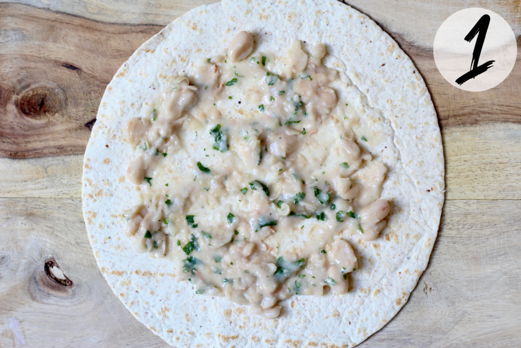 Spread white beans on wrap