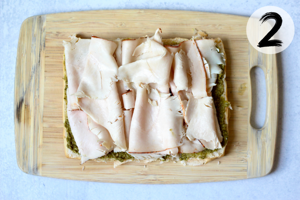 Layer sliced turkey breast on top