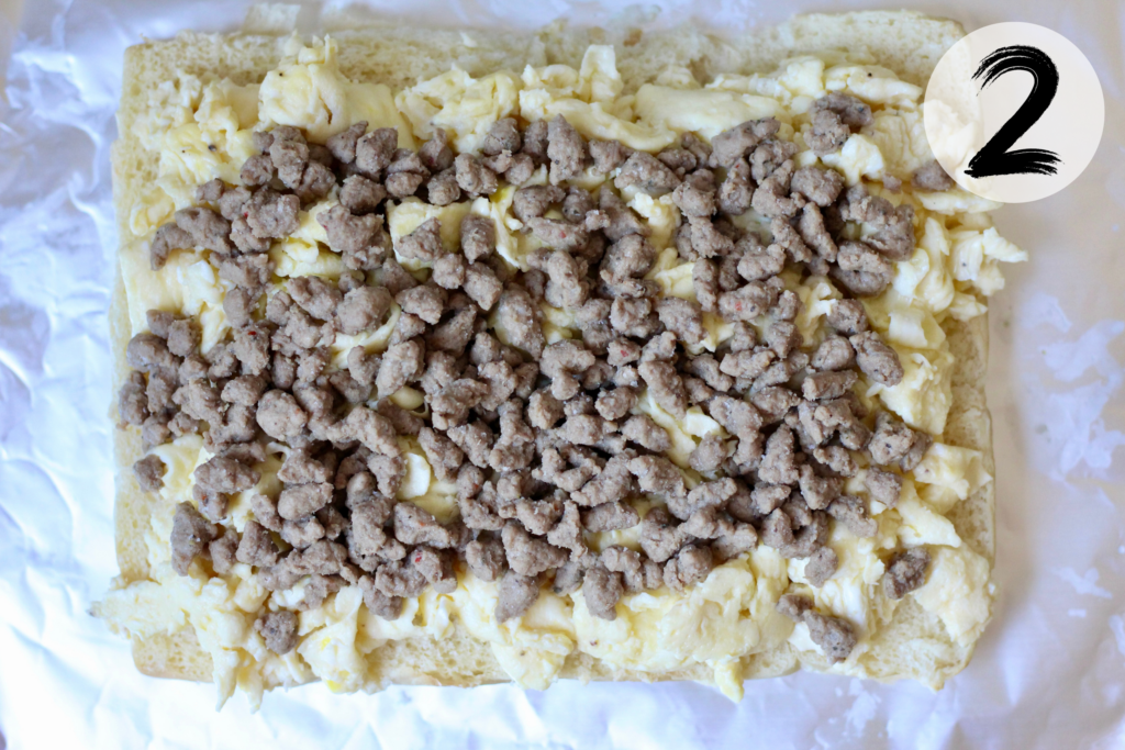 Precooked turkey sausage crumbles layered over scrambled eggs for breakfast sliders