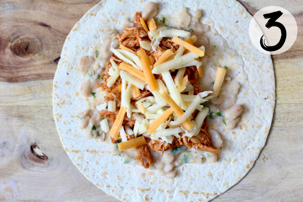 Layer with shredded cheese