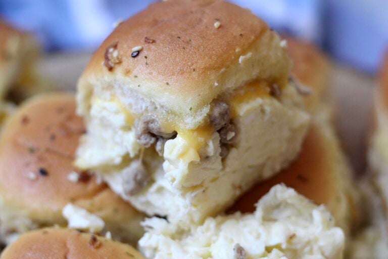 Breakfast Slider with scrambled eggs, turkey sausage and melted cheese on Hawaiian roll