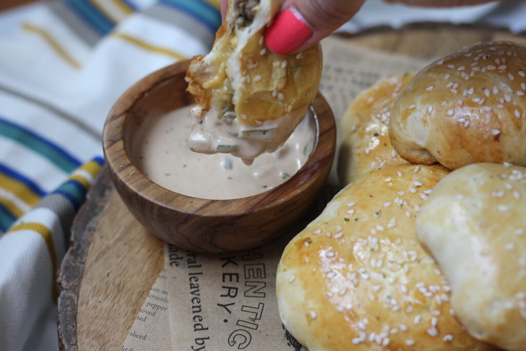 Cheeseburger bomb coated in creamy homemade special sauce
