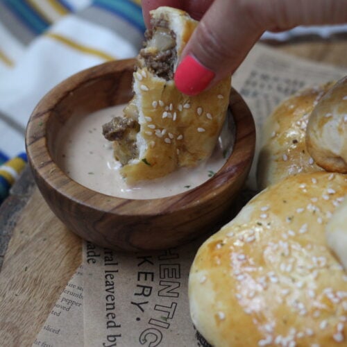 Cheeseburger bomb filled with ground beef and cheese dipped in special sauce