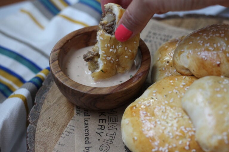 Cheeseburger bomb filled with ground beef and cheese dipped in special sauce
