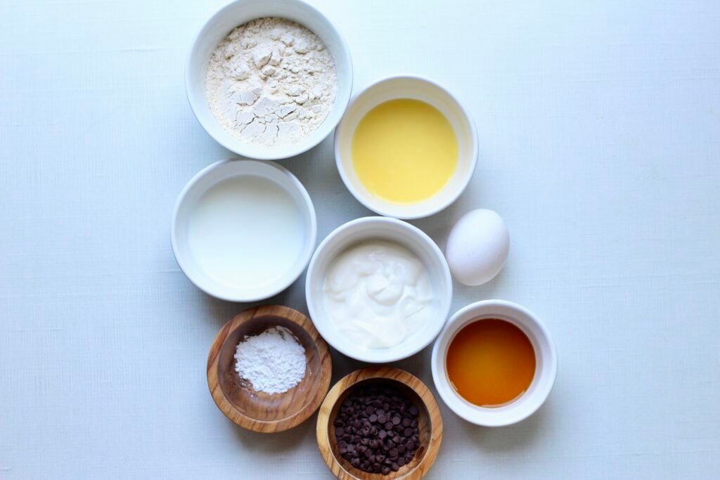 Ingredients for Kodiak chocolate chip muffins arranged on a white surface