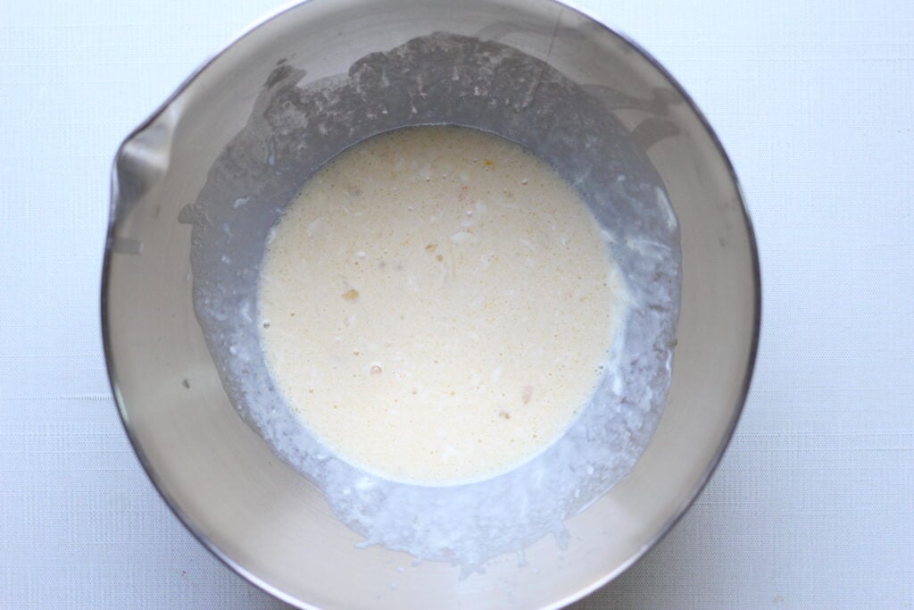 Wet ingredients combined in a bowl for Kodiak muffins
