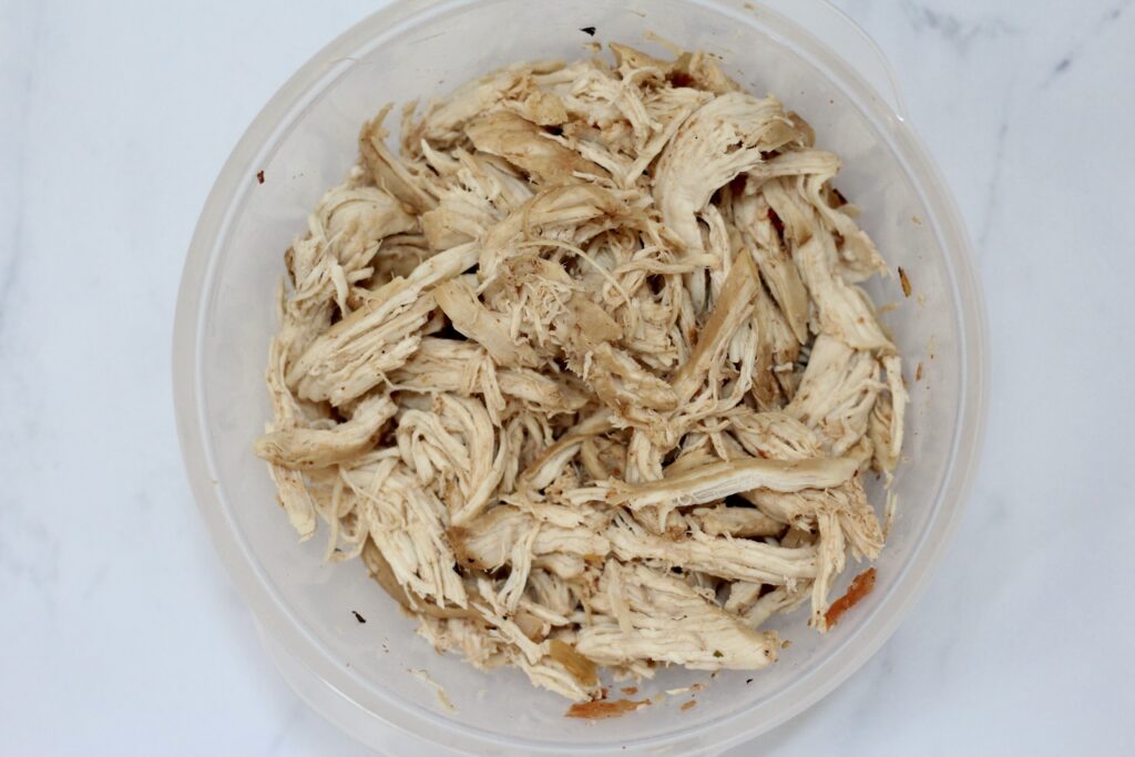 Cooked chicken breasts shredded for chicken tortilla soup.